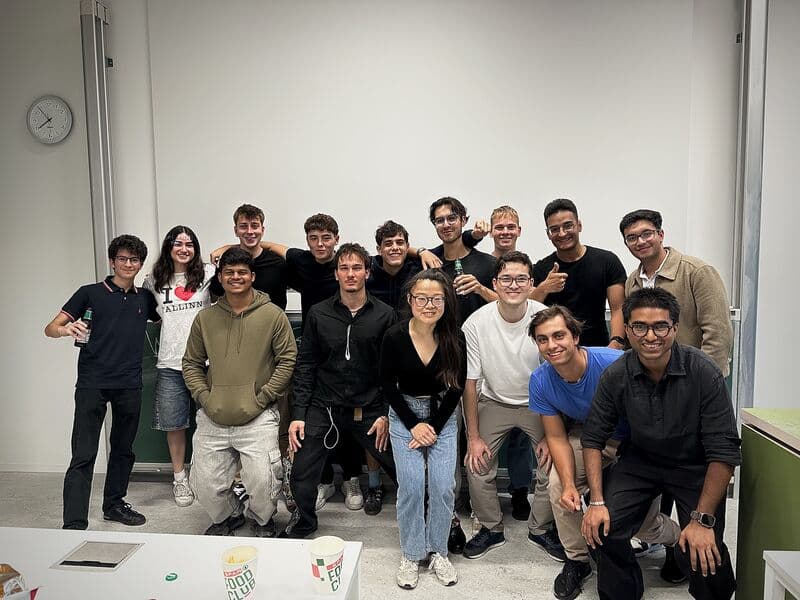 Students gathered for a group photo after the Kickoff pizza and pitch evening